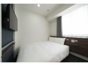 Posteľ alebo postele v izbe v ubytovaní R&B Hotel Sendai Higashiguchi - Vacation STAY 14656v