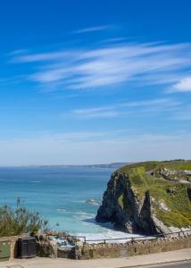 a view of the ocean from a cliff at OYO Newquay Beach Hotel in Newquay