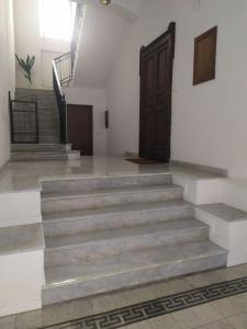 a set of stairs in a building with a door at Arte Mia B&B in Reggio di Calabria