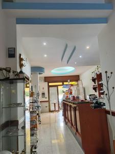 a kitchen with a counter and a blue ceiling at Hotel Edelweiss in Laino Borgo