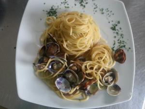 a plate of pasta with clams and mussels at Hotel Mareblu in Amantea