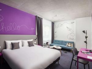 מיטה או מיטות בחדר ב-ibis Styles Budapest Airport