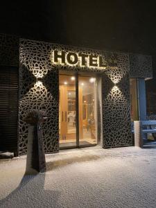 a store front of a hotel with a sign on it at Steig-Alm Hotel Superior in Bad Marienberg