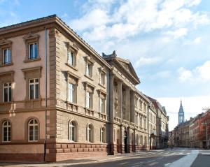 a row of buildings on a city street at Hôtel LÉONOR the place to live in Strasbourg