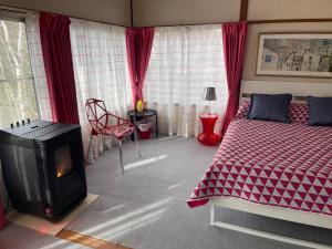 A bed or beds in a room at Naeba Ski Resort - Cottage away from usual life