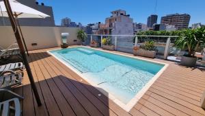 a swimming pool on the roof of a building at Fierro Hotel Buenos Aires in Buenos Aires