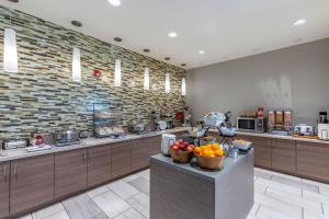 a large kitchen with bowls of fruit on a counter at Best Western Plus Zion Canyon Inn & Suites in Springdale