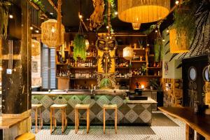 a bar with stools in front of a counter at Generator Miami in Miami Beach