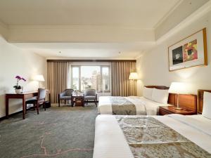 Кровать или кровати в номере The Howard Prince Hotel Taichung