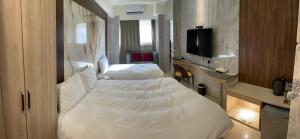 Кровать или кровати в номере Hotel Maple Taiwan Boulevard