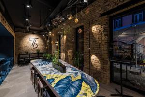 a room with a long table with plants on it at Hôtel Tandem - Boutique Hôtel in Strasbourg