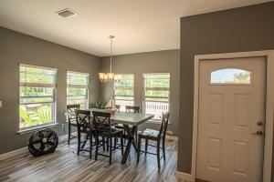 a dining room with a table and chairs at Beach Daze in Panama City Beach