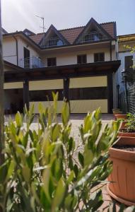 a house with a fence in front of it at Hotel Edelweiss in Laino Borgo