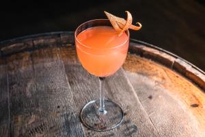 a drink in a glass on a wooden table at Plaza Hotel & Casino in Las Vegas