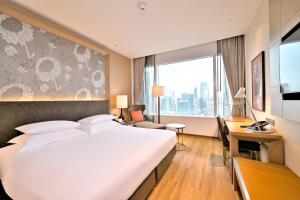 Cama ou camas em um quarto em Eastin Grand Hotel Sathorn