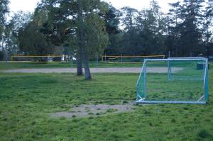 a soccer field with a goal in the grass at Hamresanden Resort in Kristiansand