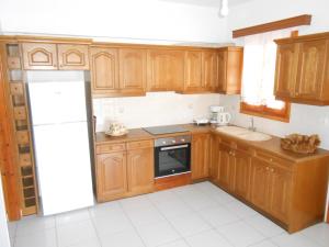 A kitchen or kitchenette at Chrysolithos Kerami Apartments