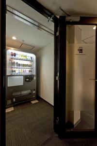 an open door to a refrigerator in a room at Hotel Gran Ms Kyoto in Kyoto