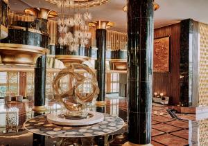 a lobby with a large room with a clock on a table at Sunway Resort Hotel in Kuala Lumpur