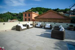 a patio with couches and chairs on a roof at Dimora de Matera Luxury Suites in Cosenza