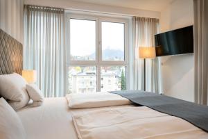 Voodi või voodid majutusasutuse AVALON Hotel Bad Reichenhall toas