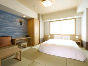 A bed or beds in a room at Onyado Nono Sendai Natural Hot Spring