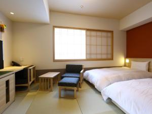 A bed or beds in a room at Onyado Nono Sendai Natural Hot Spring