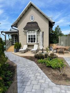 a house with a patio and a table at Lilla Sand in Porvoo