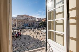 an open window with a view of a building at Boemio FLH Hotels in Lisbon