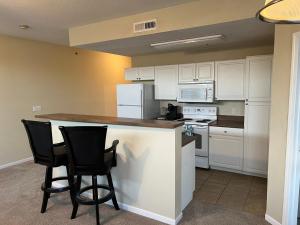 A kitchen or kitchenette at WASHBURN HOTEL SUITES