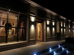 a view of a store front at night at Allobroges Park Hôtel in Annecy