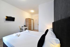 Krevet ili kreveti u jedinici u objektu Virtus Apartments and Rooms with Free Private Parking