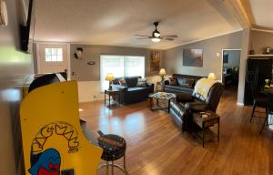 a living room with a couch and a table at Bear Doodle 2.0 in Sevierville