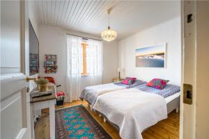 Säng eller sängar i ett rum på Luleå Village Cabin