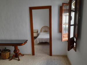 Posteľ alebo postele v izbe v ubytovaní Apartamento Corredera - Casa Andaluza en Centro Histórico