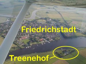 a view of a river from an airplane at Pension Treenehof in Friedrichstadt