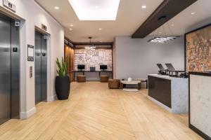 an office with a lobby with a reception desk at Hyatt Place Gainesville Downtown in Gainesville