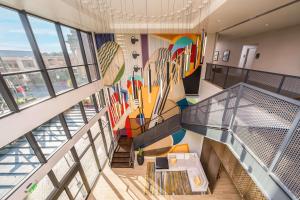 an overhead view of a building with a skateboard mural at Hyatt Place Gainesville Downtown in Gainesville