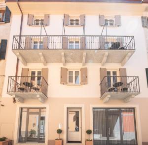 an external view of a building with balconies at Antico Borgo B&B in Cannobio