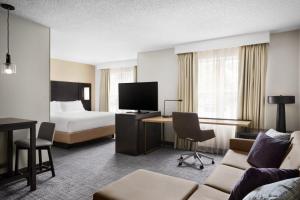 a hotel room with a bed and a desk at Residence Inn by Marriott Harrisburg Carlisle in Carlisle