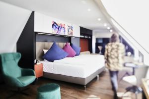 Voodi või voodid majutusasutuse Design- und Kunsthotel München toas