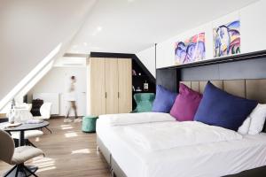 Voodi või voodid majutusasutuse Design- und Kunsthotel München toas