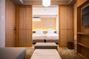 Cama ou camas em um quarto em Miru Kyoto Gion