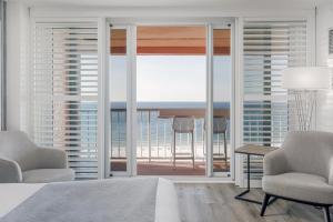 a living room with a view of the ocean at Perdido Beach Resort in Orange Beach