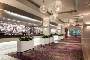 a hallway with potted plants in a lobby at Sheraton Princess Kaiulani in Honolulu