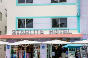 a starine hotel with umbrellas in front of it at Starlite Hotel in Miami Beach