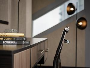 a pile of books sitting on a counter in a room at Montcalm East, Autograph Collection in London