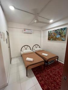 A bed or beds in a room at MyDusun Chalet, Taiping, Perak, Malaysia