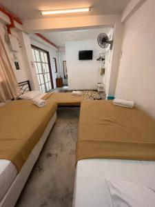 A bed or beds in a room at MyDusun Chalet, Taiping, Perak, Malaysia