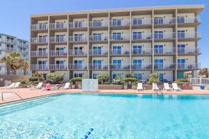 a swimming pool in front of a hotel at Boardwalk Inn and Suites in Daytona Beach